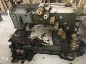 Gray And White Overlock Sewing Machine