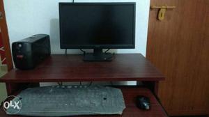 Black Computer UPS, Flat Screen Monitor, Corded Mouse, And