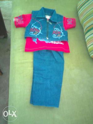 Blue jacket and red t shirt and blue trouser