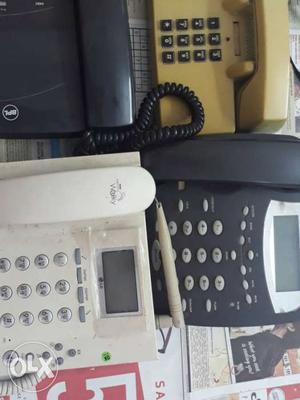 Four Black And White Home Phones