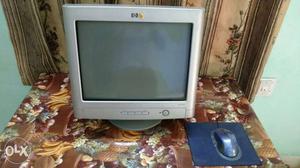 Gray HP CRT Computer Monitor And Blue Corded Computer Mouse