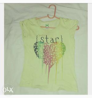 Printed green tee for girls of age 7 to 8