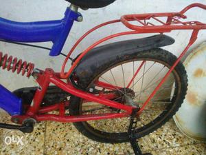 Red And Blue Full-suspension Bicycle