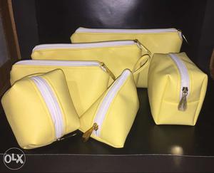 Six Yellow Leather Bags