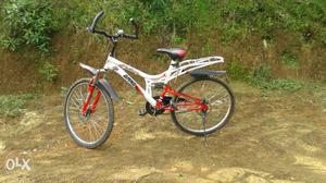 White And Orange Full-suspension Bicycle