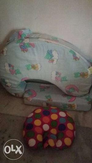 Feeding pillow and baby head pillow for sleeping.