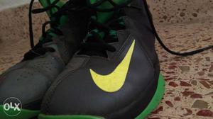 Pair Of Black-and-green Nike Basketball Shoes