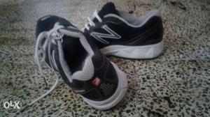 Pair Of Black-and-white New Balance Running Shoes