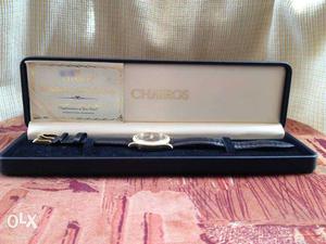 Round gold Frame Chairos Watch With Black Leather Strap In