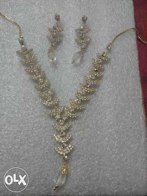 Silver And Gold Necklace And Earrings