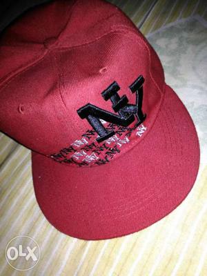 A red colour hip hop cap