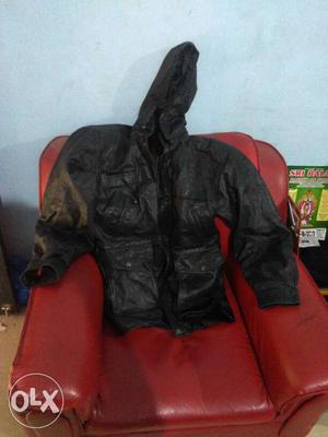Genuine leather jacket with hood and pair of gloves