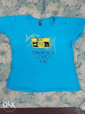 Its a pretty blue top with a quote. Colour-Blue