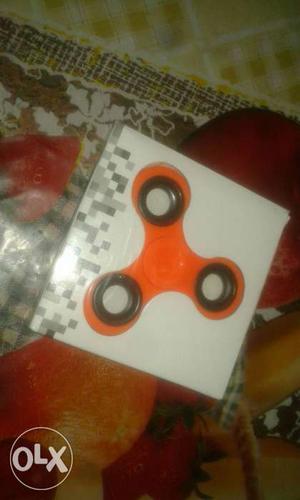Orange spinner new brand only 1day use