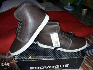 Pair Of Black-and-white Provogue High Top Sneakers On Box