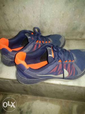 Pair Of Blue-and-orange Nike Running Shoes
