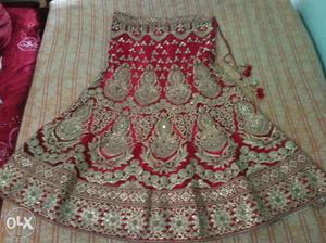 Red and golden bridal lehnga with heavy embroidery