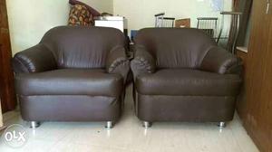 Two Dark Brown Leather Armchairs