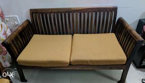 2 seater solid wood sofa for sale. Teak finish. 2