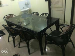 6 seater cane dining table with chairs and sofa