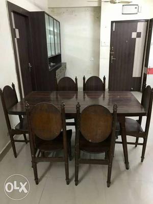 6-seater wooden dining table with 6 chairs with