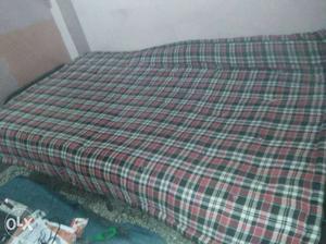 A 6*4 single cot with mattress is up for sale.