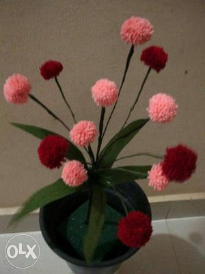 Artificial Pink And Red Flowers On Black Pot