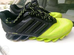 Black-and-green Adidas Spring Blade's