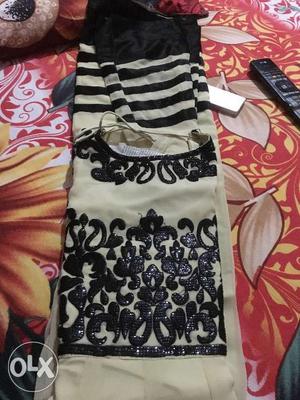 Black with light brown shade anarkali suit. Only