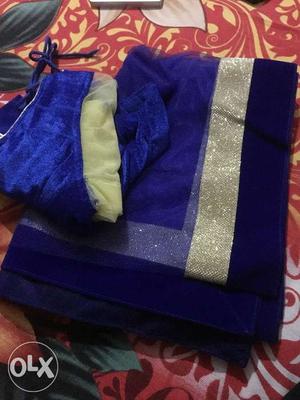 Blue duptta with blue and cream color lehnga.