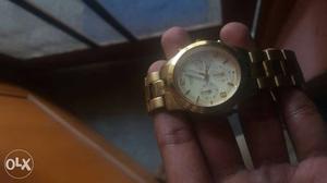 Branded guess watch for ladies with gold color