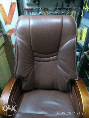 Brown Wooden Base Brown Leather Padded Armchair