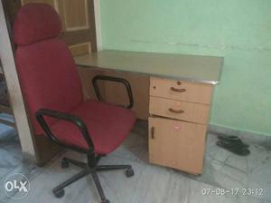 Brown Wooden Desk With Black And Red Rolling Office Chair