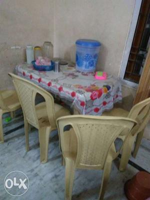 Dinning table with four chair, very less used with cover