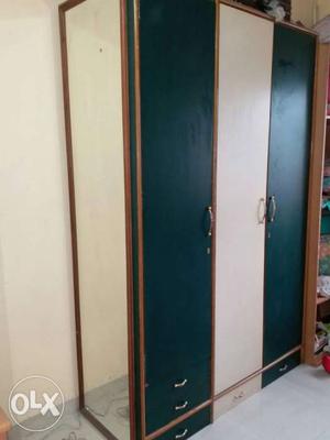Heavy wooden cupboard with full length mirror.