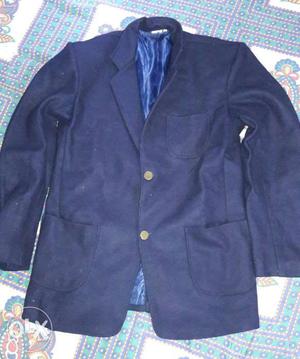 Navy blue colored school blazer in a very good