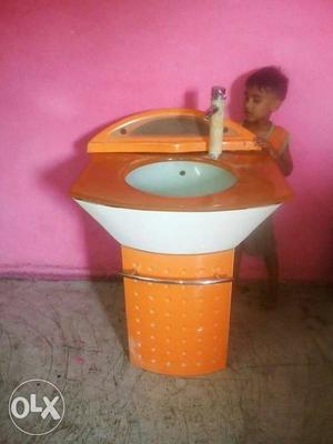 Orange And White Ceramic Pedestal Sink