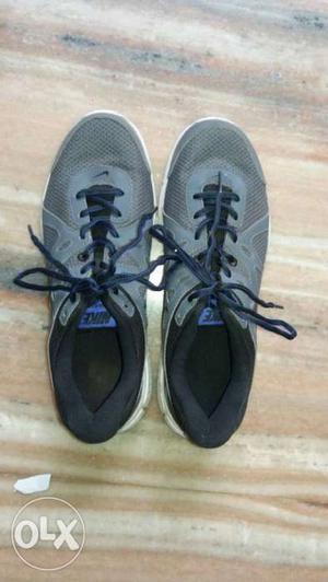 Pair Of Black And Gray Nike Sport Shoes