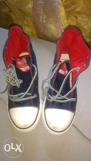 Pair Of Black-and-red High-top Sneakers