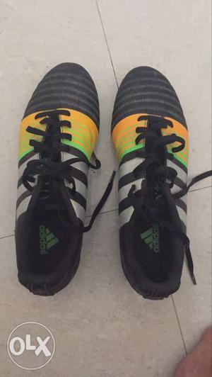 Pair Of Black-and-yellow Adidas Cleats