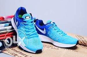 Pair Of Blue-and-teal Nike Shoes