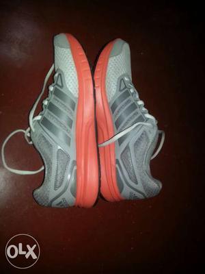 Pair Of Gray Adidas Athletic Shoes