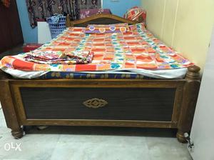 Pure teak bed with intricate designs along with branded