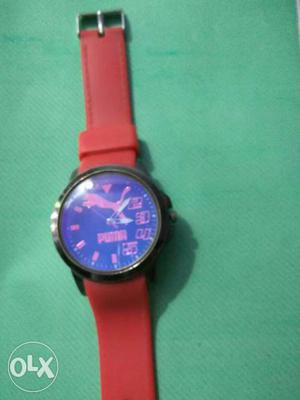 Red colour wrist watch with blue colour dial