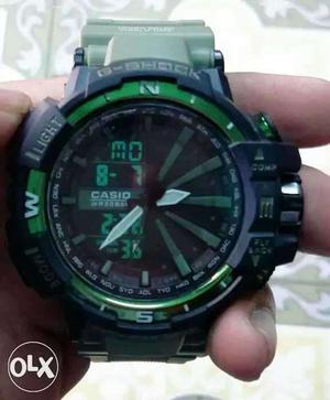 Round Black Casio Digital Watch With Green Silicone Band