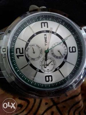 Round White Timex Chronograph Watch With Silver Link