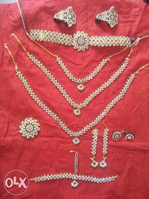 Silver Necklaces, Bracelet, And Earrings