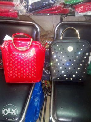Two Red And Black Leather Handbags