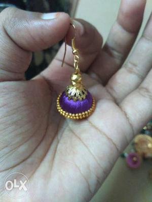 Unpaired Purple And Gold Jhumka Earrings