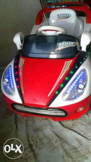 White, Red, And Black Ride On Toy Car